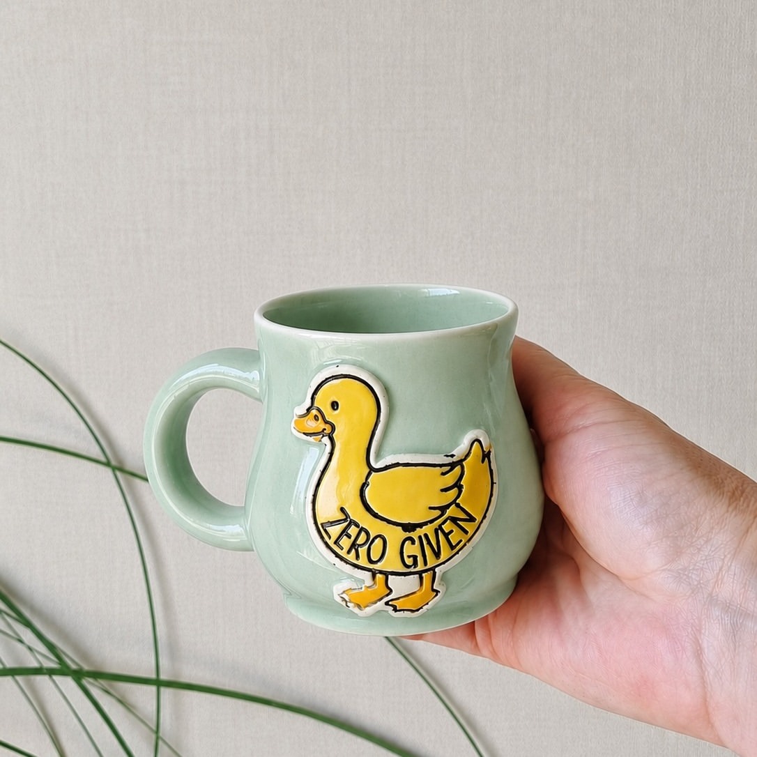 PREORDERS ARE LIVE 

Meet your new Emotional Support Duck.
Handmade. Hand glazed. Carrying approximately ZERO DUCKS TO GIVE. 

Choose your vibe:

> Duck Pond Blue (Speckled)
> Bubblegum Rose
> Minted Celadon

Lovingly handcrafted in small batches right here in the Camo Chicken studio — complete with all the glorious handmade goodness, organic variations and ducky attitude you'd expect.

✨ BONUS PREORDER PERK ✨
Every preorder scores a FREE limited edition sneak peek into the Next Duck magnet — a cheeky teaser of what's waddling into the studio next.

PREORDER NOW — estimated delivery 9th June.

👉 ORDER VIA WEBSITE LINK IN BIO
(Not the comments, ya beautiful chaos goblins 😘)

#camochickenceramics #handmadepottery #emotionalsupportduck #zeroducks #potterymug #nzmade #taupo #ceramics #handcrafted #muglife #functionalceramics #ducksofinstagram